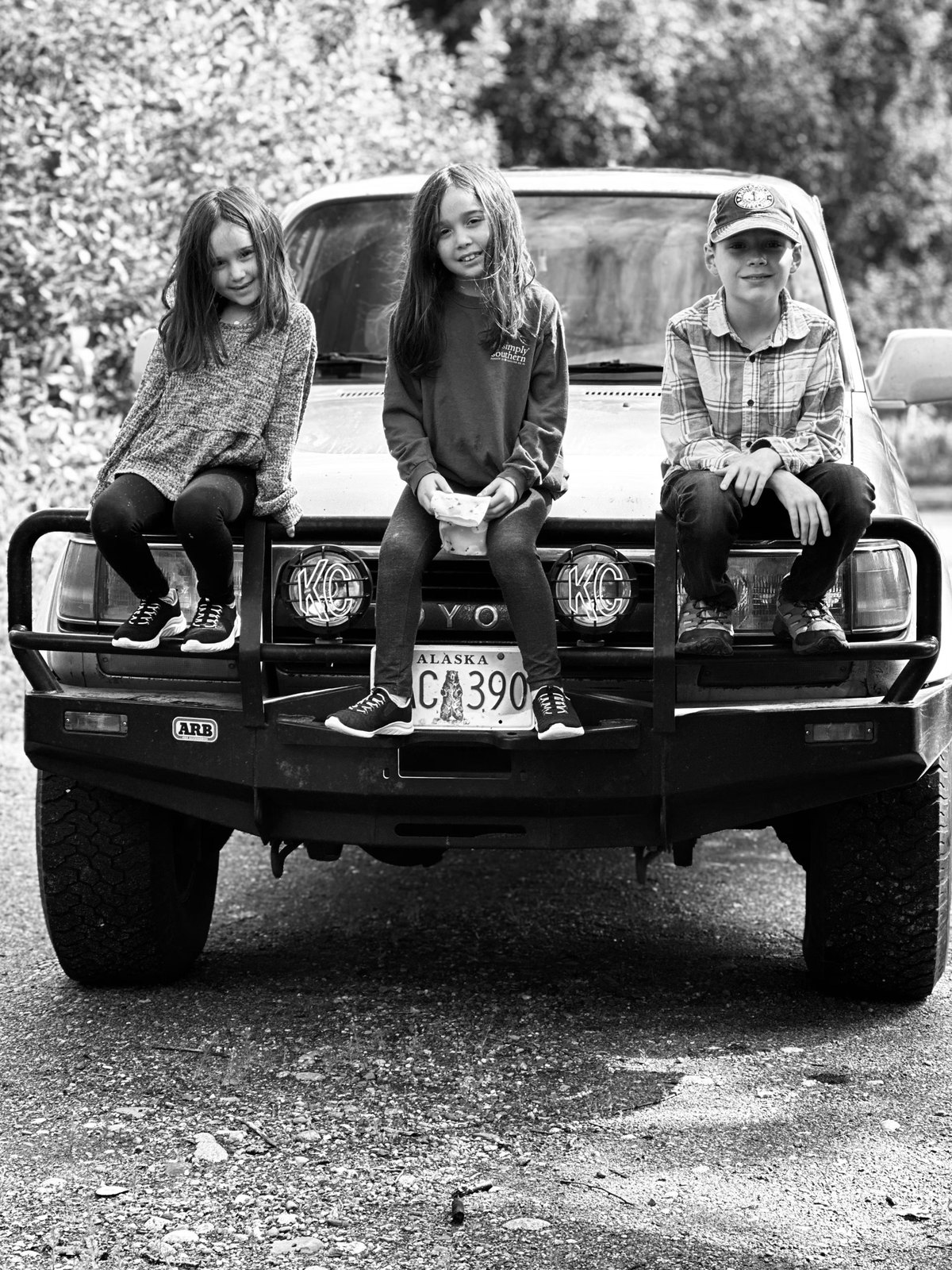 The Evans children on a family Land Cruiser
